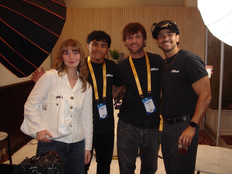 Four crew members with lanyards on, together at the end of a shoot