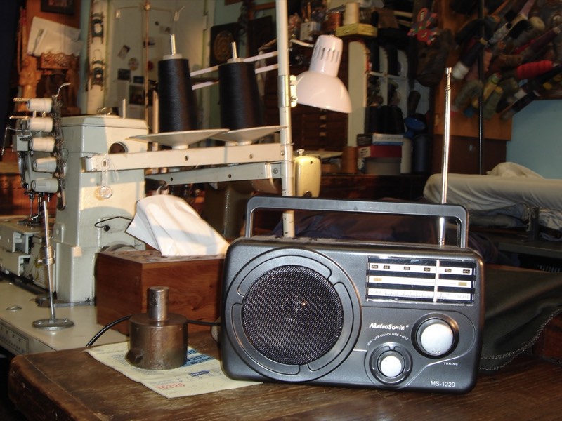Props laid out on a table, a vintage radio among them